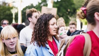 A photo of a group of young people at a climate march.