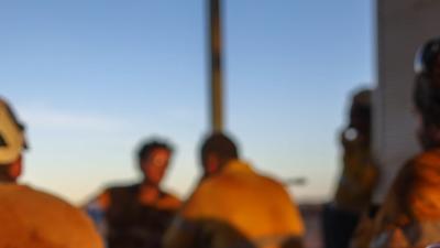 A group of construction workers chatting