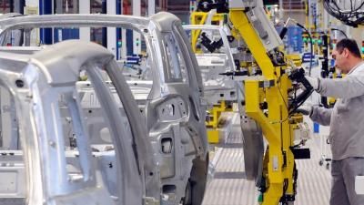 A man operating a car production line