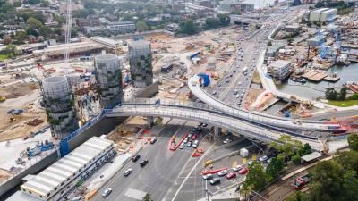 An aerial shot of a large construction site by a road in Sydney.