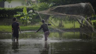 Two people with fishing nets
