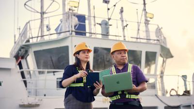 Dr Sanley and a team member on a training ship.