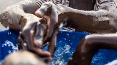Children washing their hands