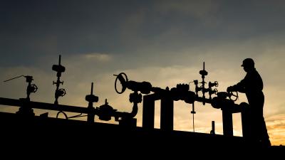 Silhouette of the oilfield worker