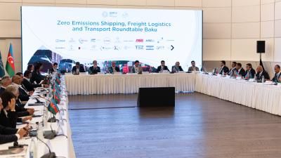 industry leaders sit around large table for discussion 
