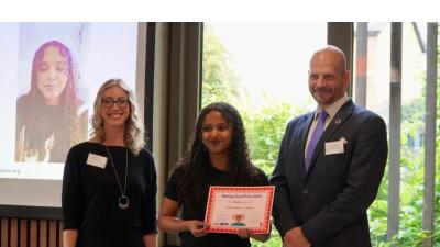 Winners of Making Spaces project holding a certificate