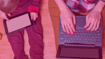 Child and woman using tablet and laptop