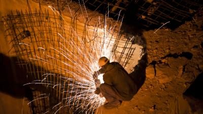 Kenyan construction worker welding