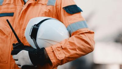 Maritime worker holding hard hat