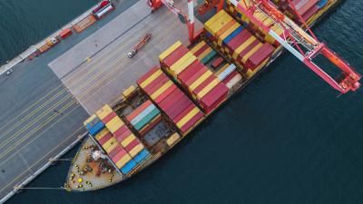 Aerial view of a container ship being unloaded/loaded.