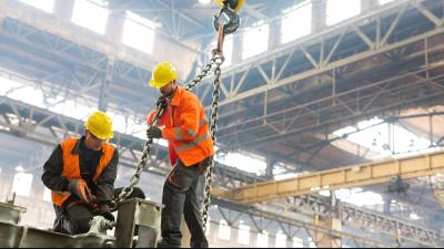 Steel workers in factory