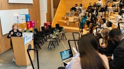Woman leading session in conference venue