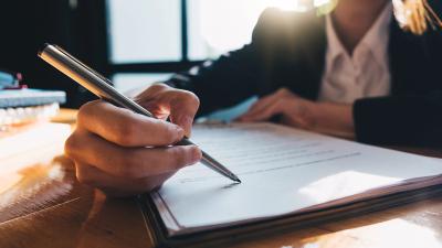 businessman signing documents