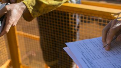 Workers revising checklist