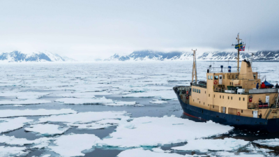 Expedition vessel cruising through arctic