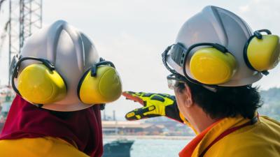 oil rig worker pointing