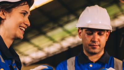 Male and female workers in a factory