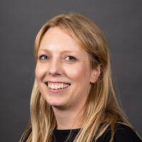 A profile photograph of Louise Sanger.